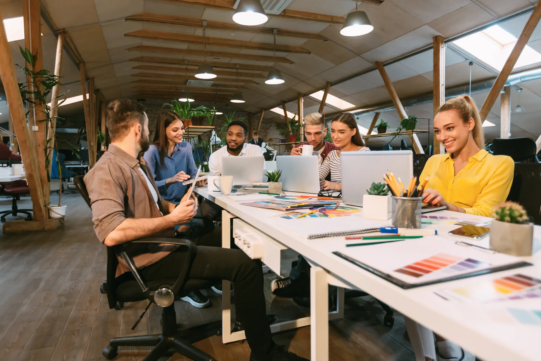 Modern workplace team collaborating during employee onboarding