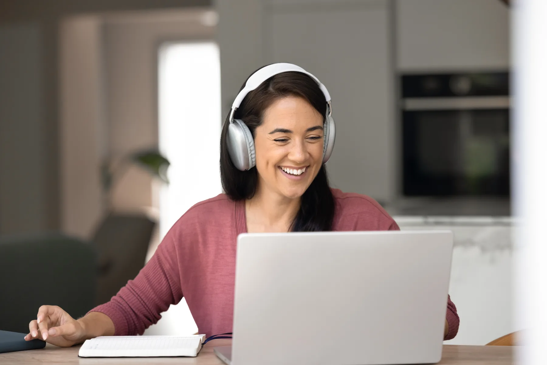 Adult learner participating in an online course from home