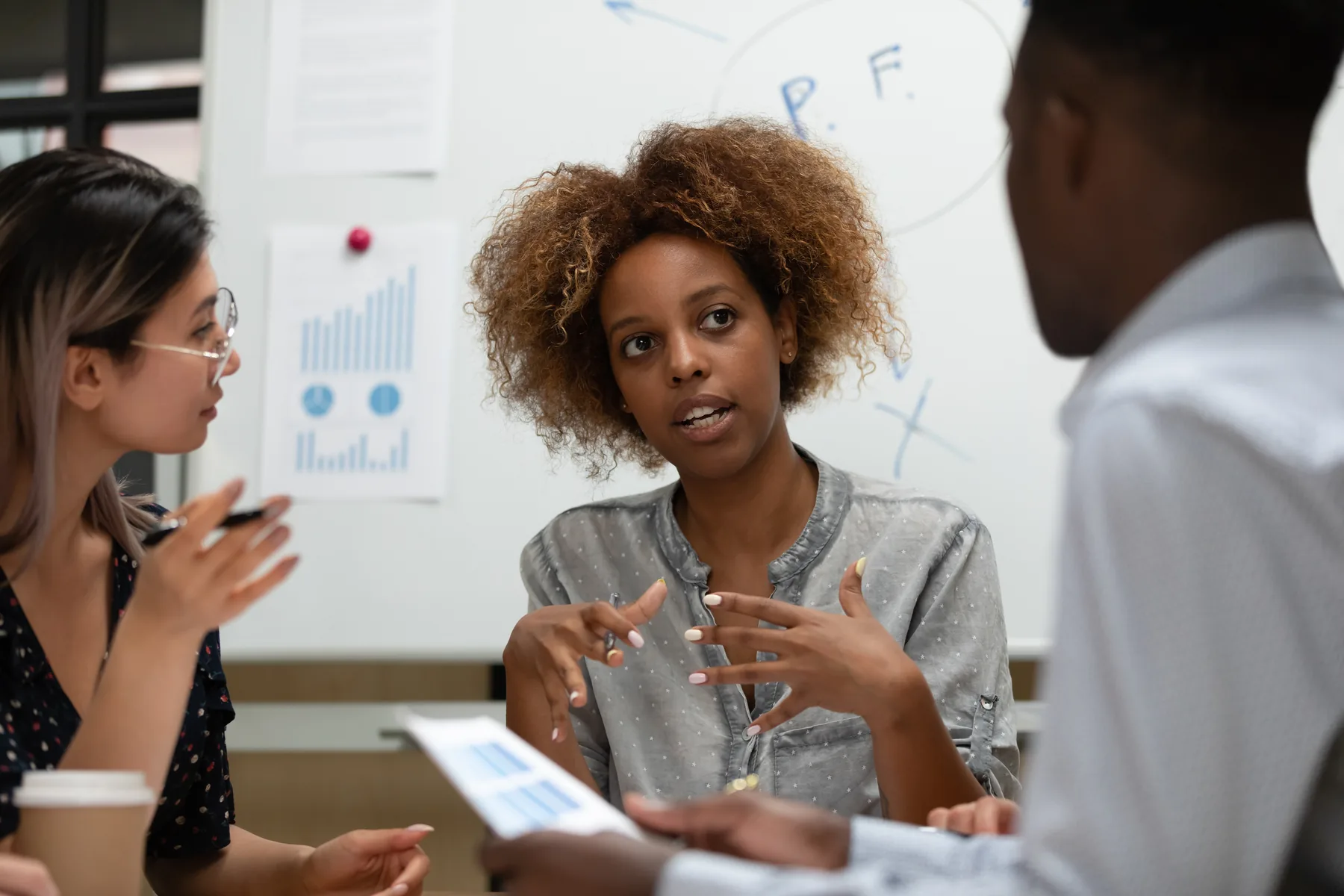 Professionals discussing realistic compliance decisions